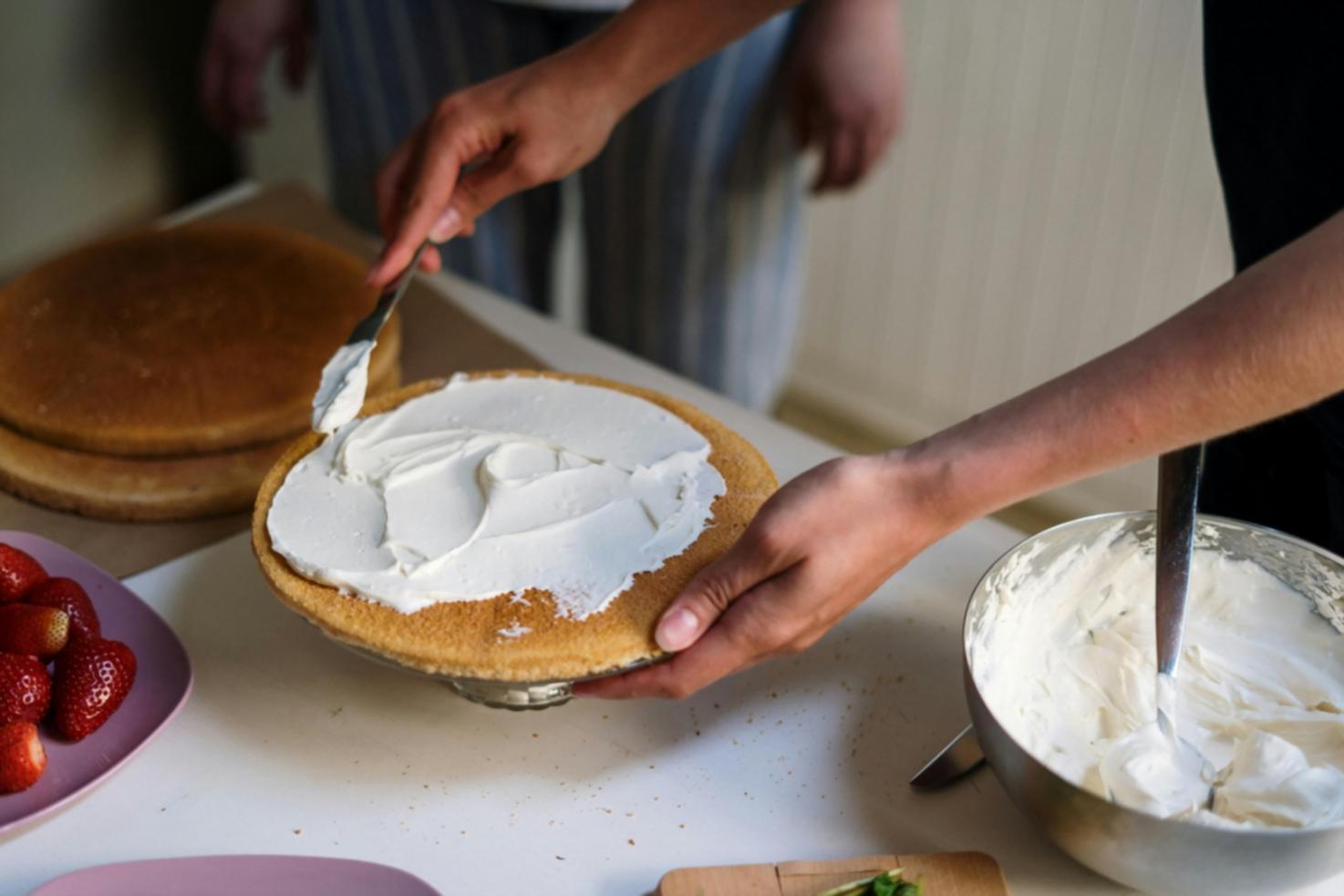 Participant cooking during a live online national cuisine training session